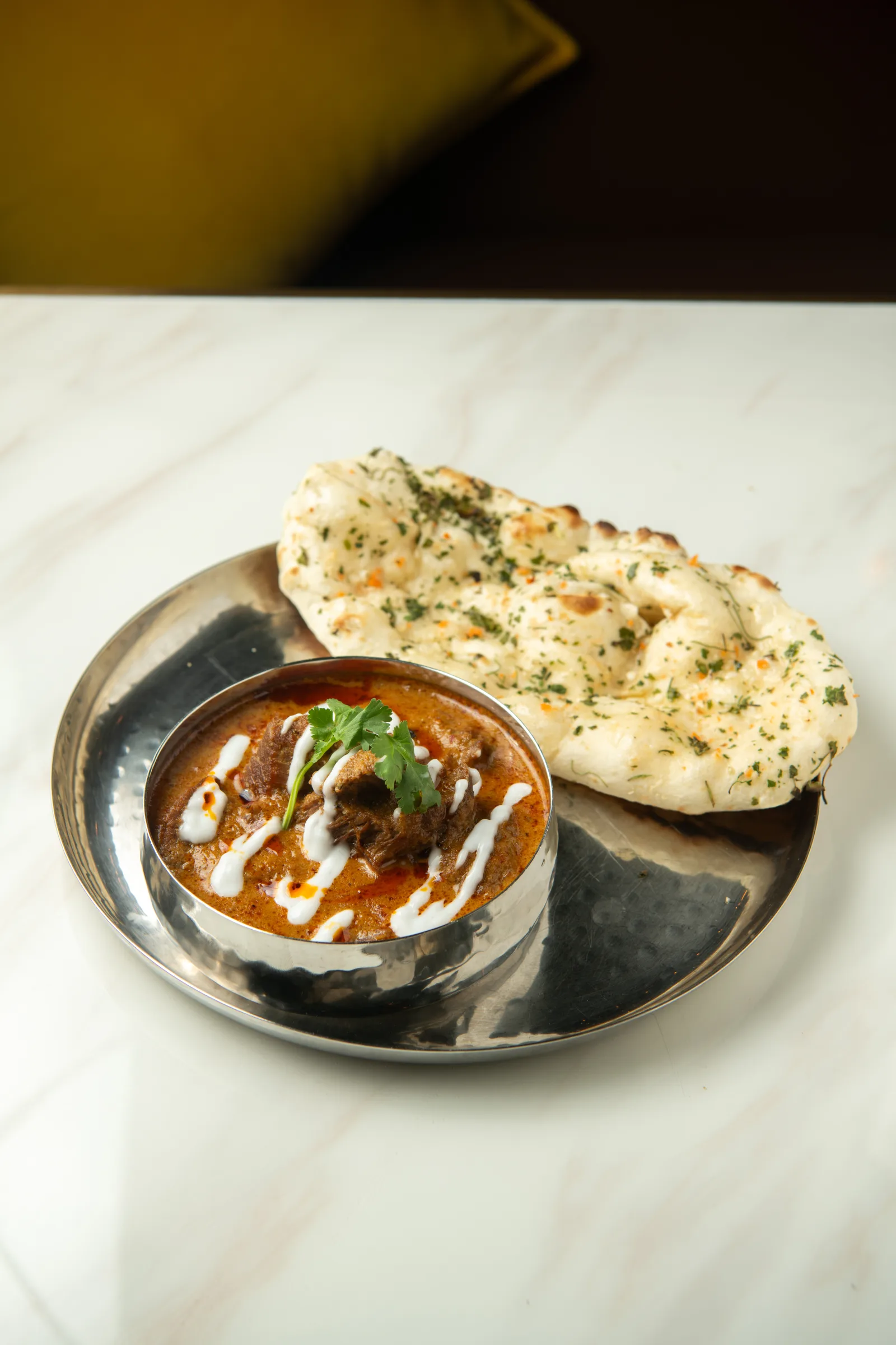 Coconut beef curry with rice and bread