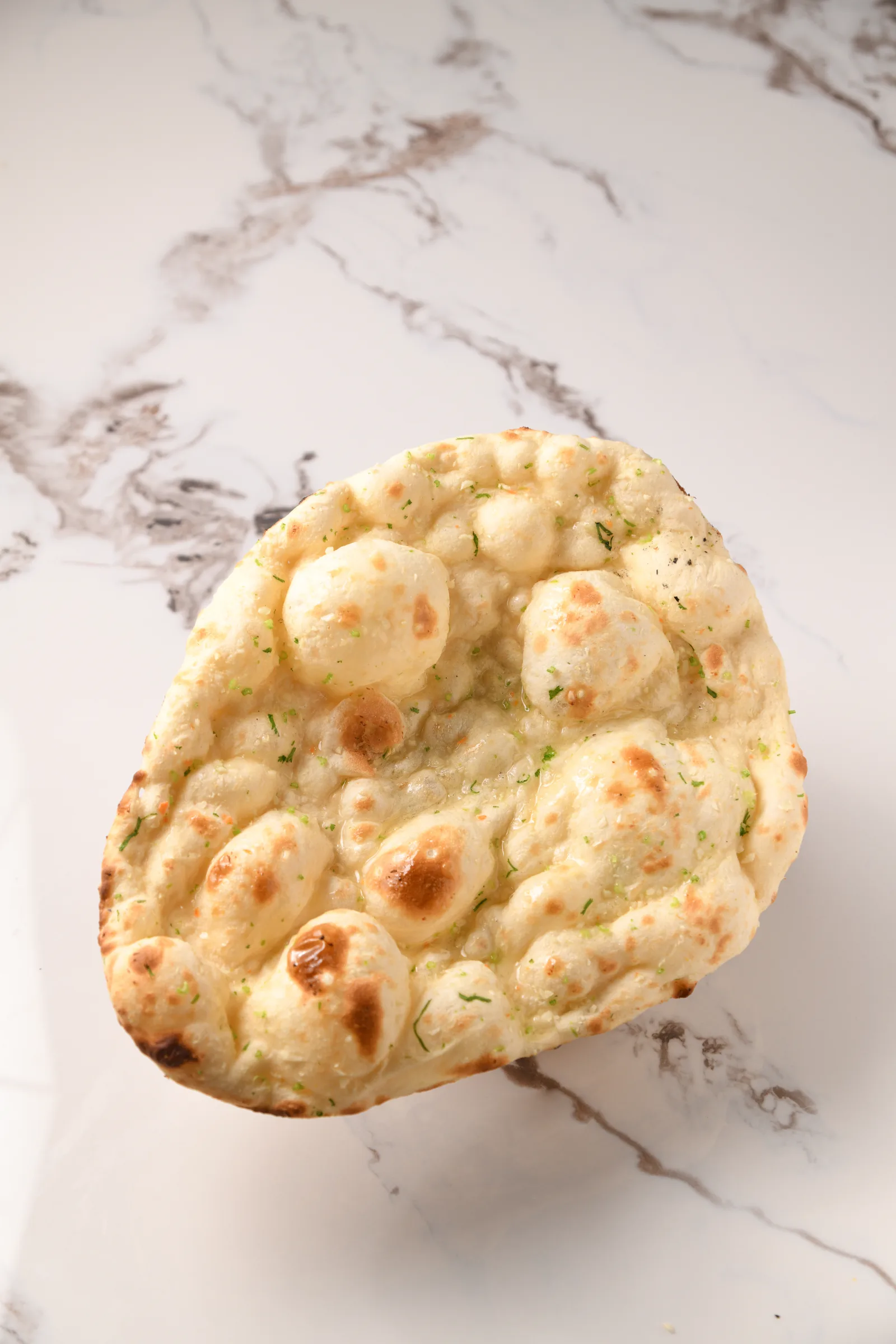 Garlic naan topped with coriander