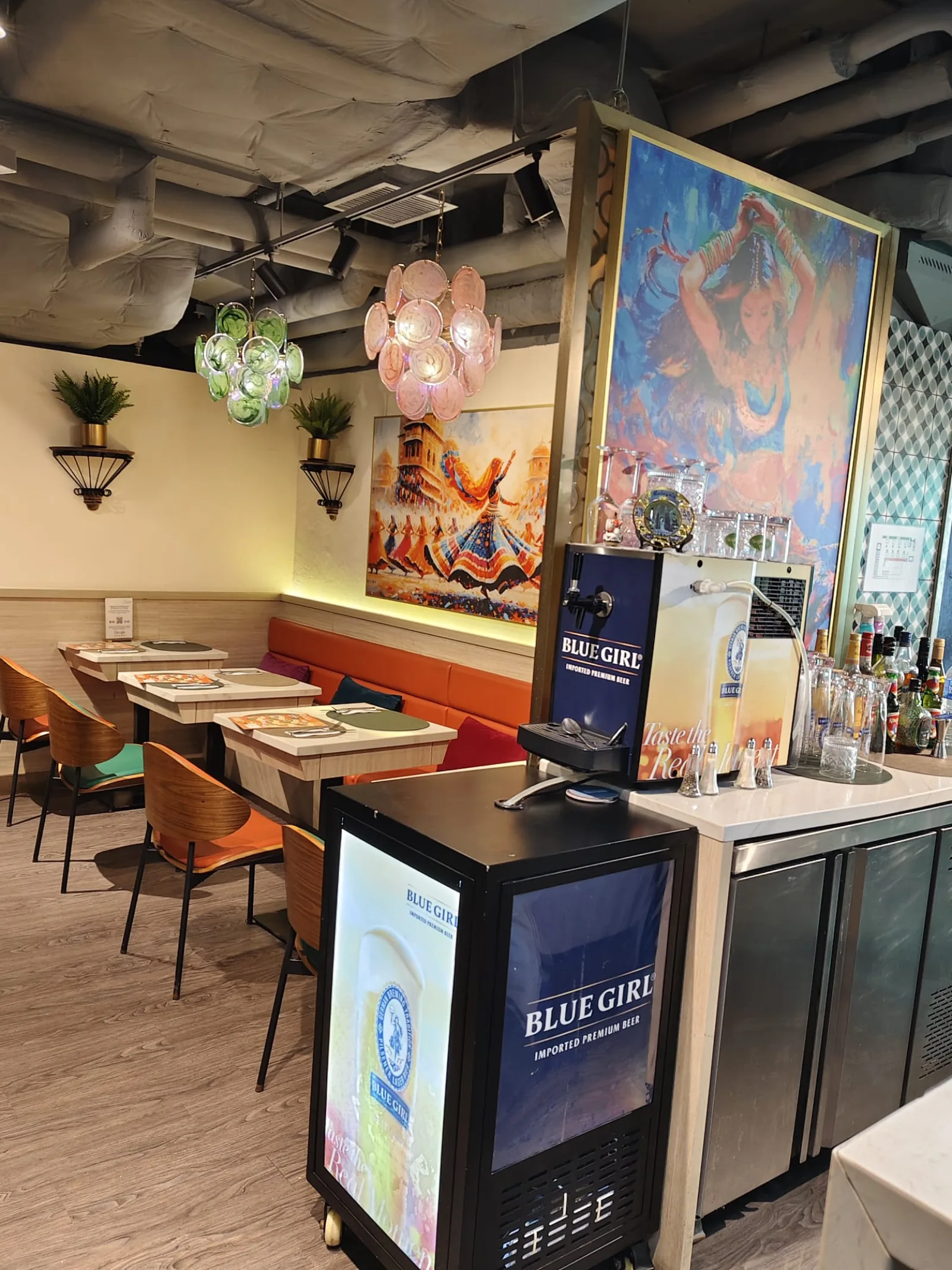 Booth seating beneath the dining room mural