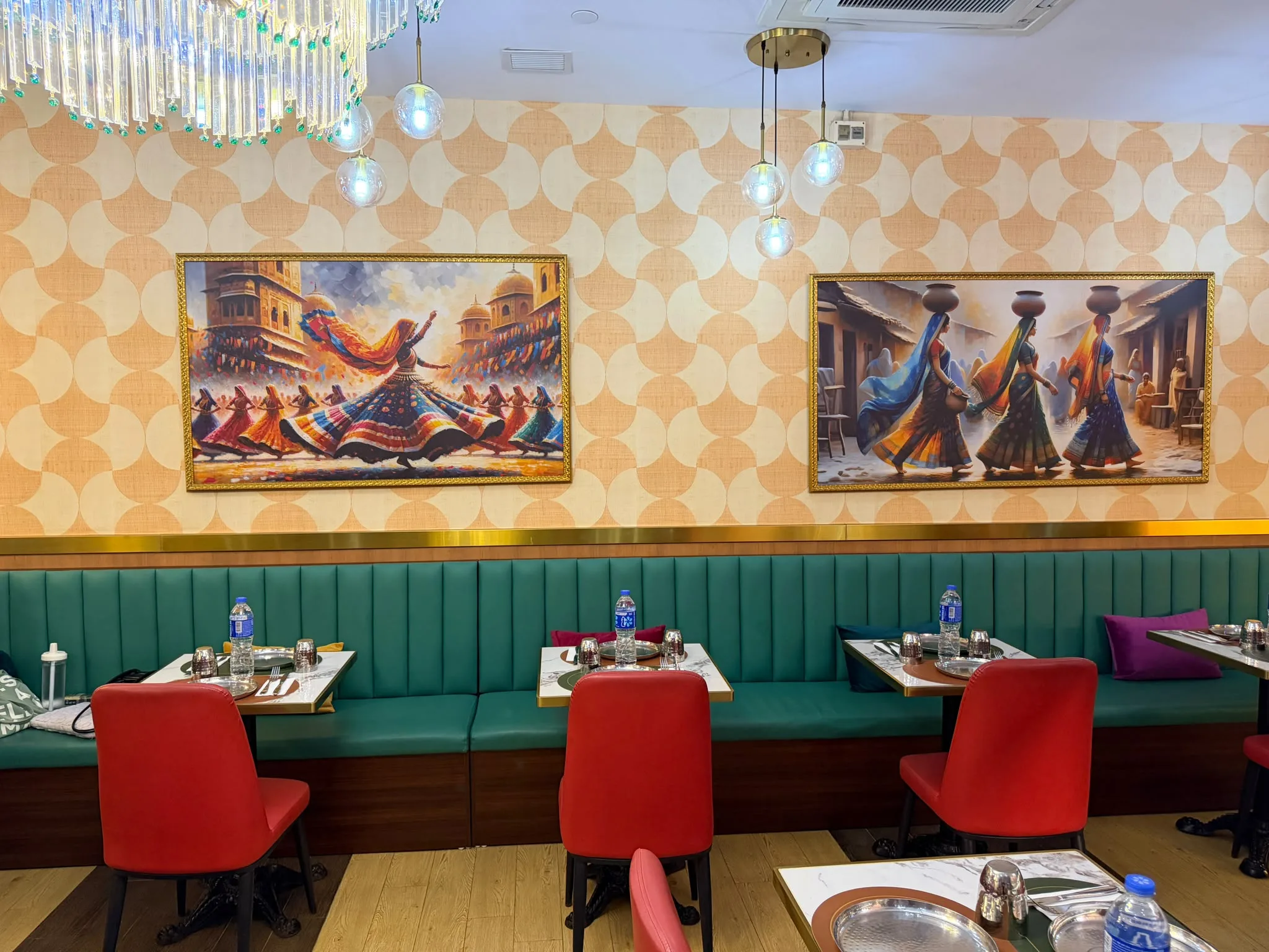 The dining room banquette under the Tulsi paintings