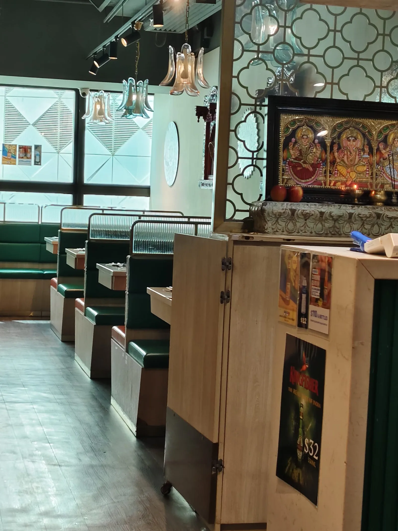 Booths beneath the dining room shrine